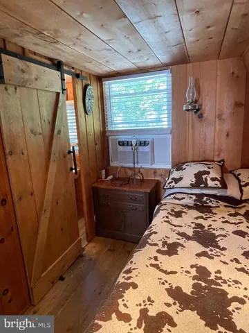 a bed room with a bed and a window