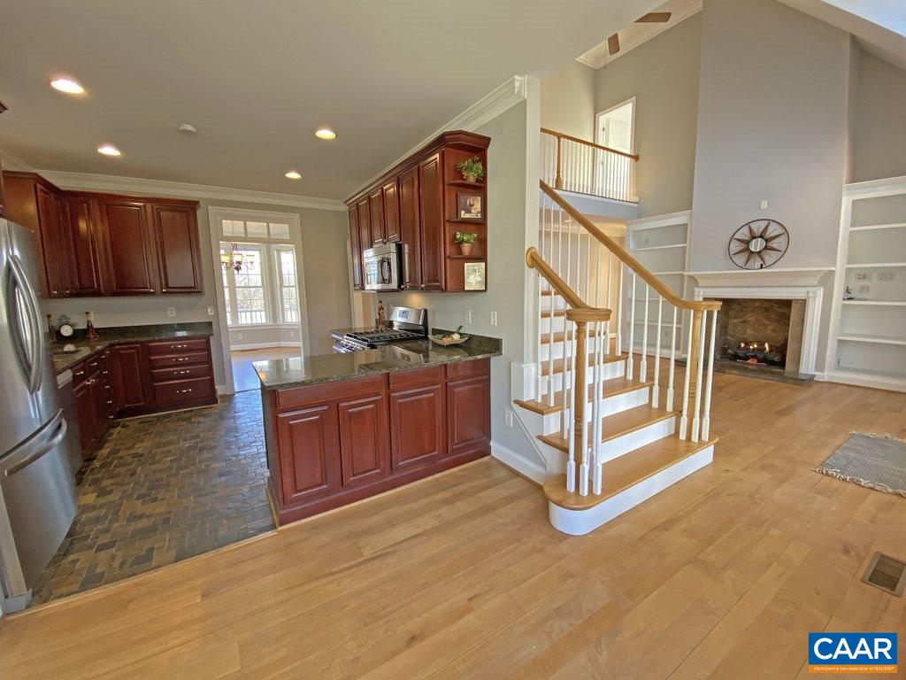 1050 Garth Road Stanardsville, VA 22973 - Photo 9 of 29 a view of a kitchen with cabinets and flat screen tv