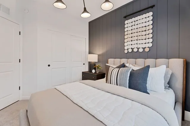 a bedroom with bed and a window