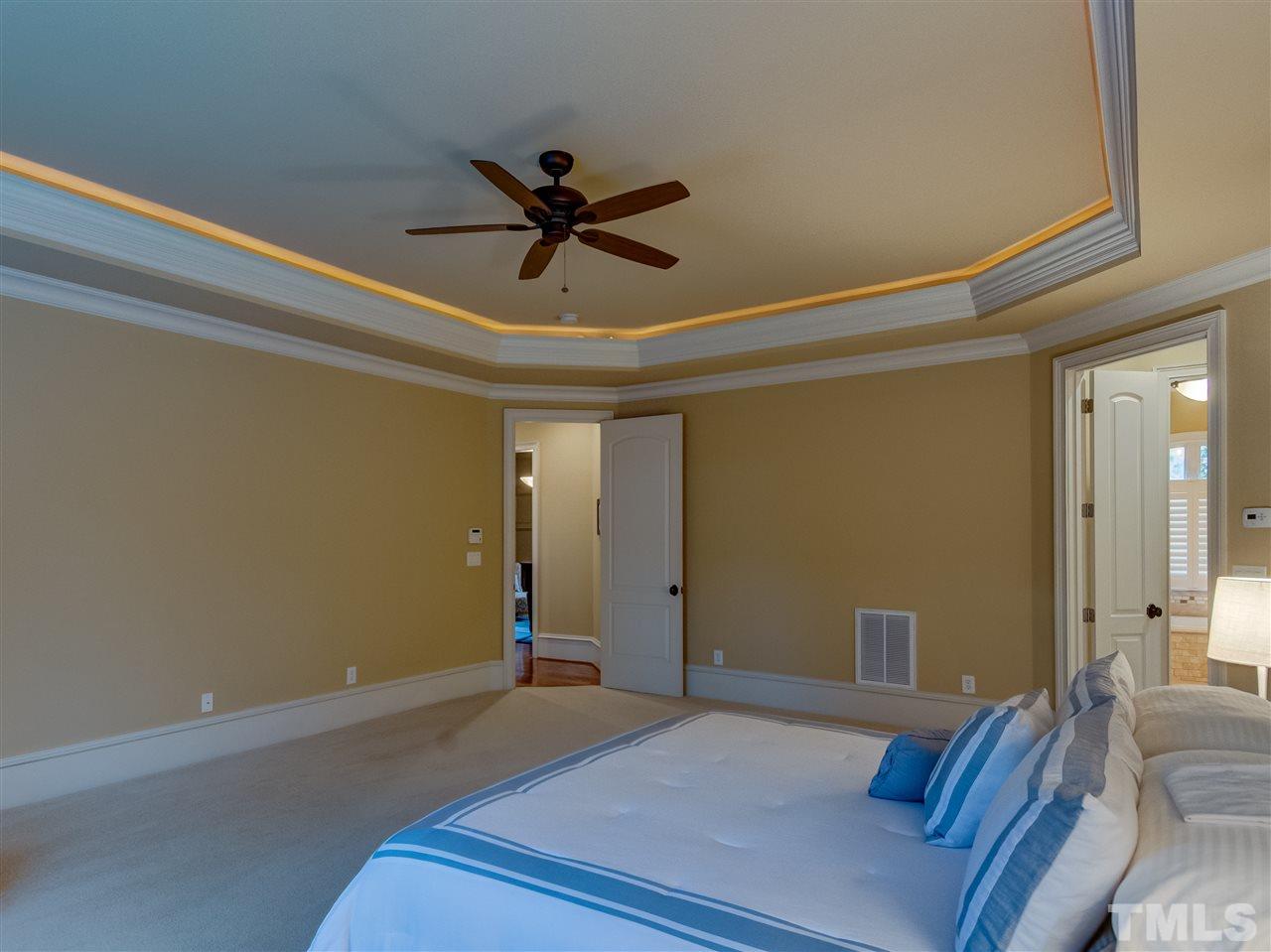 1908 Ridge Road Raleigh, NC 27607 - Photo 14 of 30 a bedroom with a bed and a ceiling fan