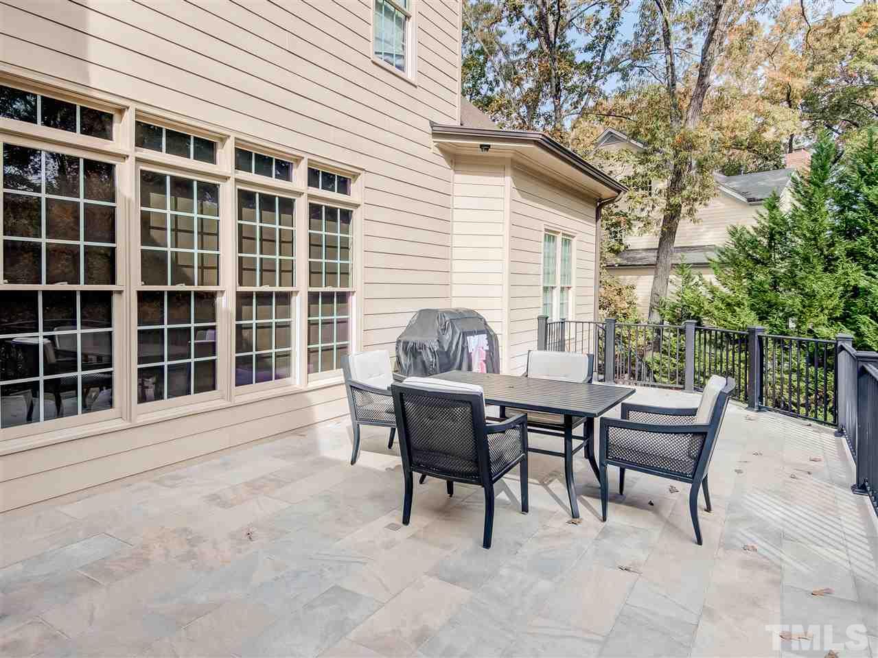 1908 Ridge Road Raleigh, NC 27607 - Photo 24 of 30 a view of a patio with a table and chairs and couches
