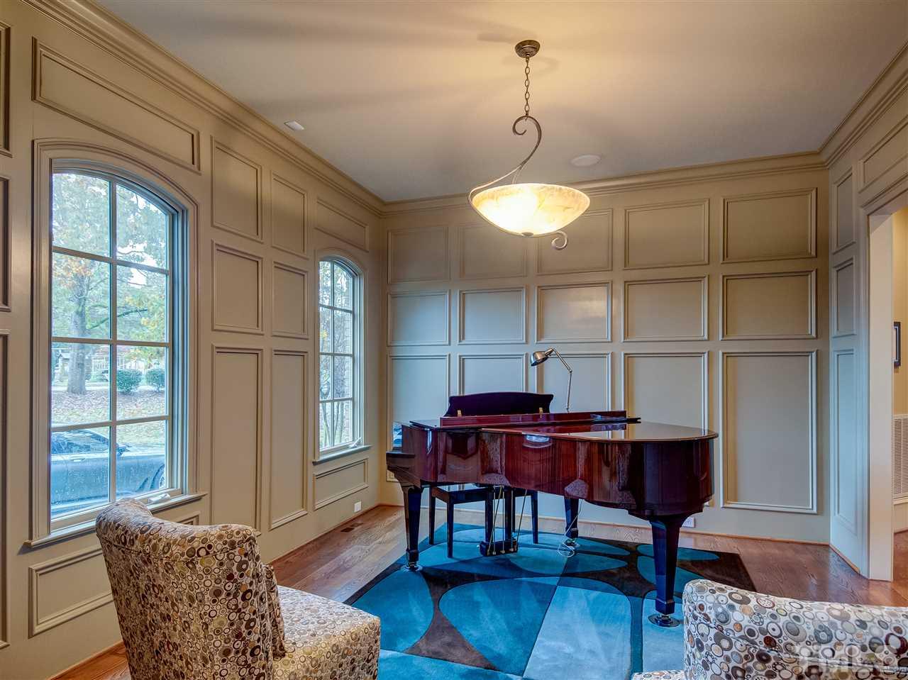 1908 Ridge Road Raleigh, NC 27607 - Photo 5 of 30 a view of a dining room with furniture window and wooden floor