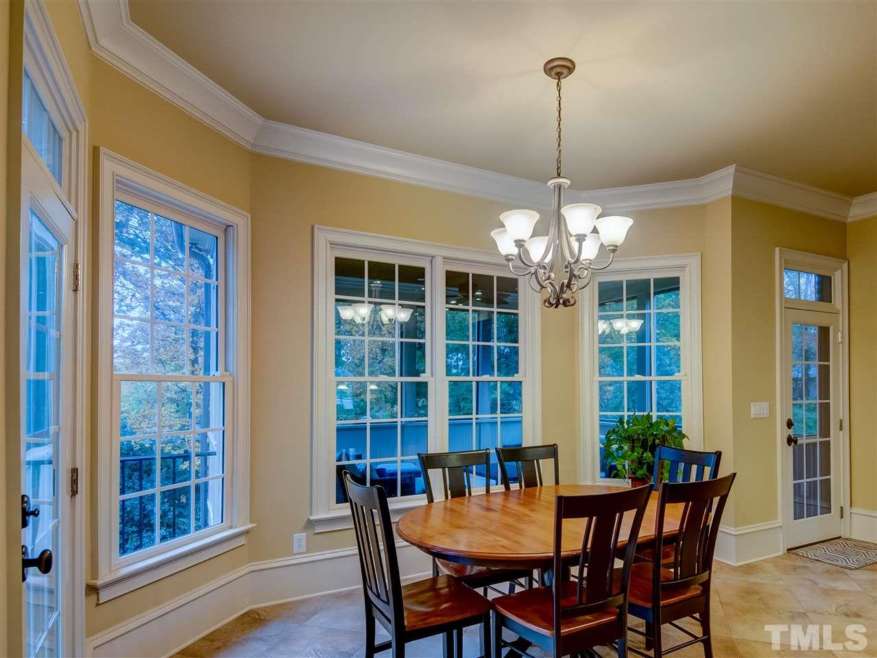1908 Ridge Road Raleigh, NC 27607 - Photo 9 of 30 a view of a dining room with furniture window and chandelier
