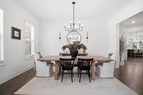 a view of living room with furniture and a chandelier