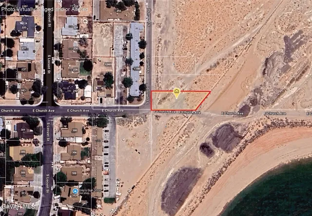 a view of a backyard of a house