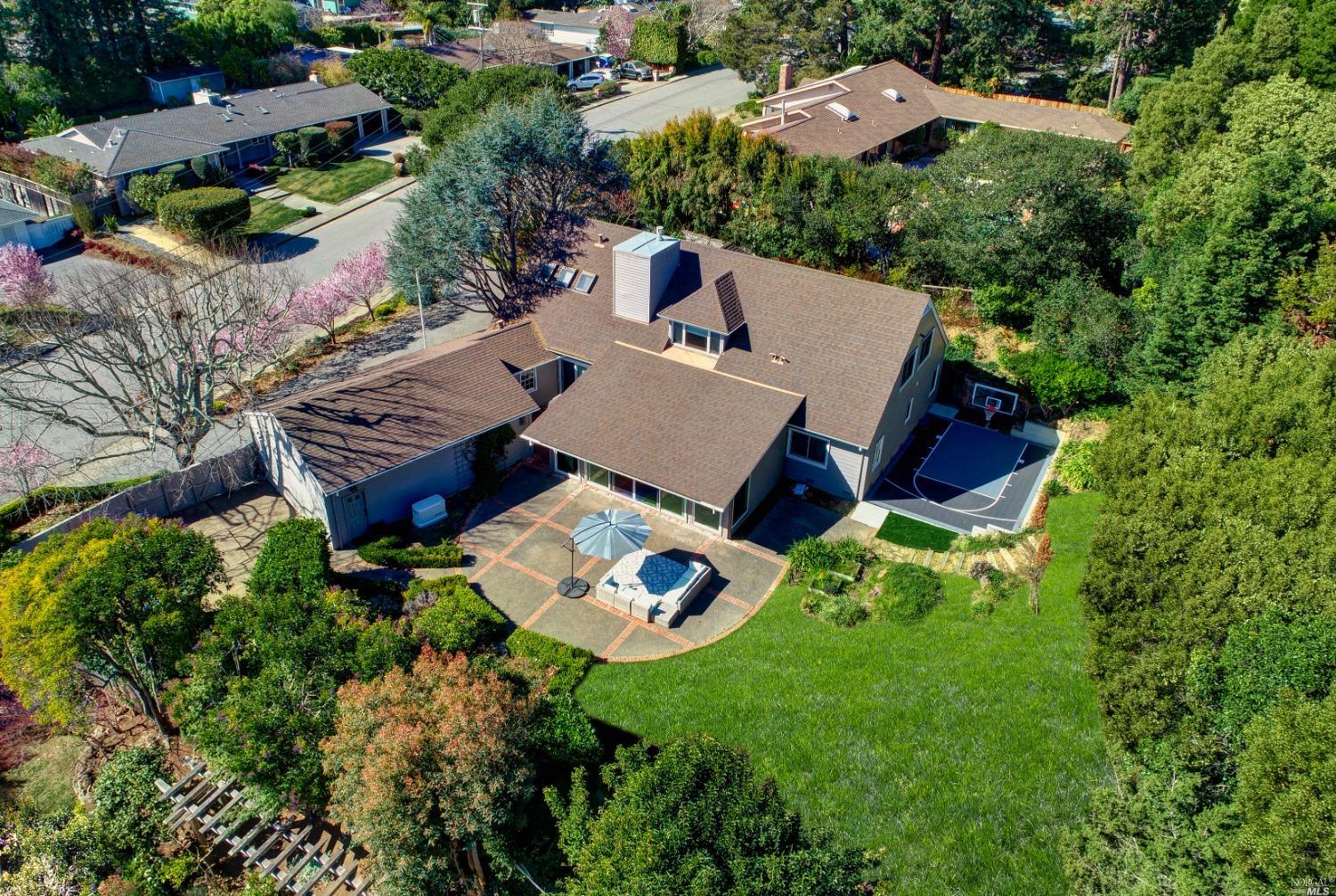 an aerial view of a house with a yard