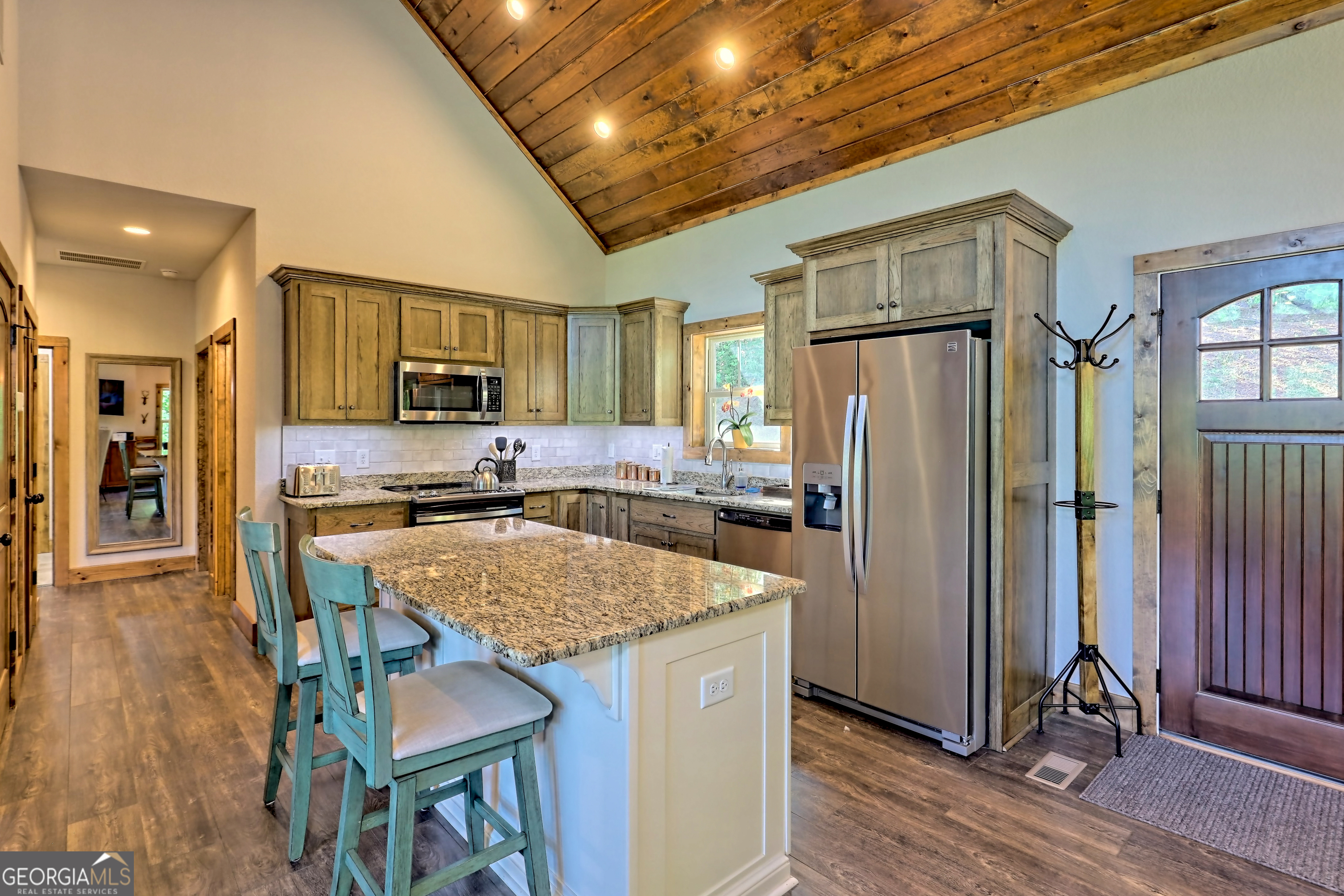 4979 Highway 197 Clarkesville, GA 30523 - Photo 14 of 62 a kitchen with stainless steel appliances granite countertop a refrigerator and a stove top oven