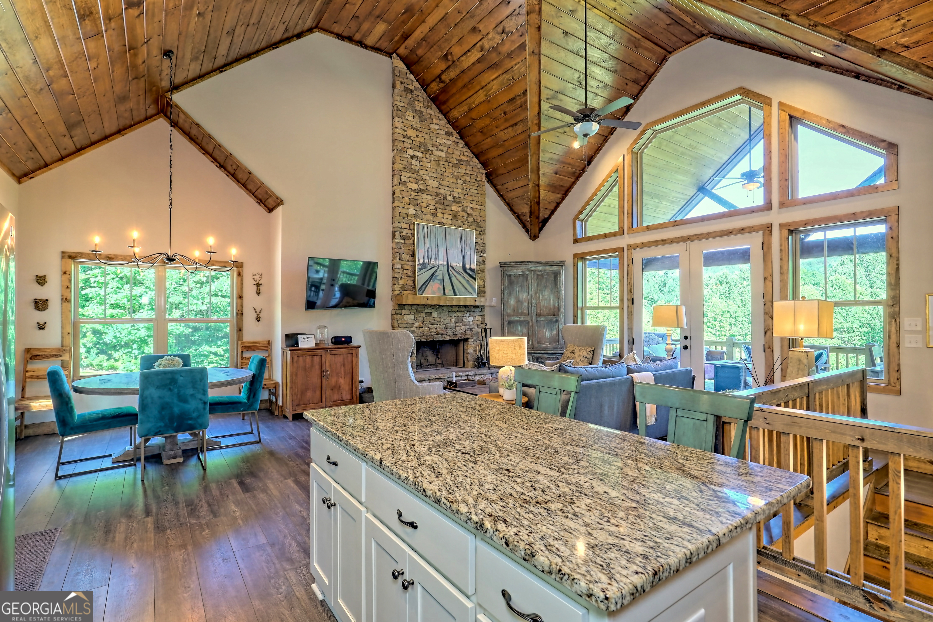 4979 Highway 197 Clarkesville, GA 30523 - Photo 16 of 62 a view of a living room and kitchen with a large window