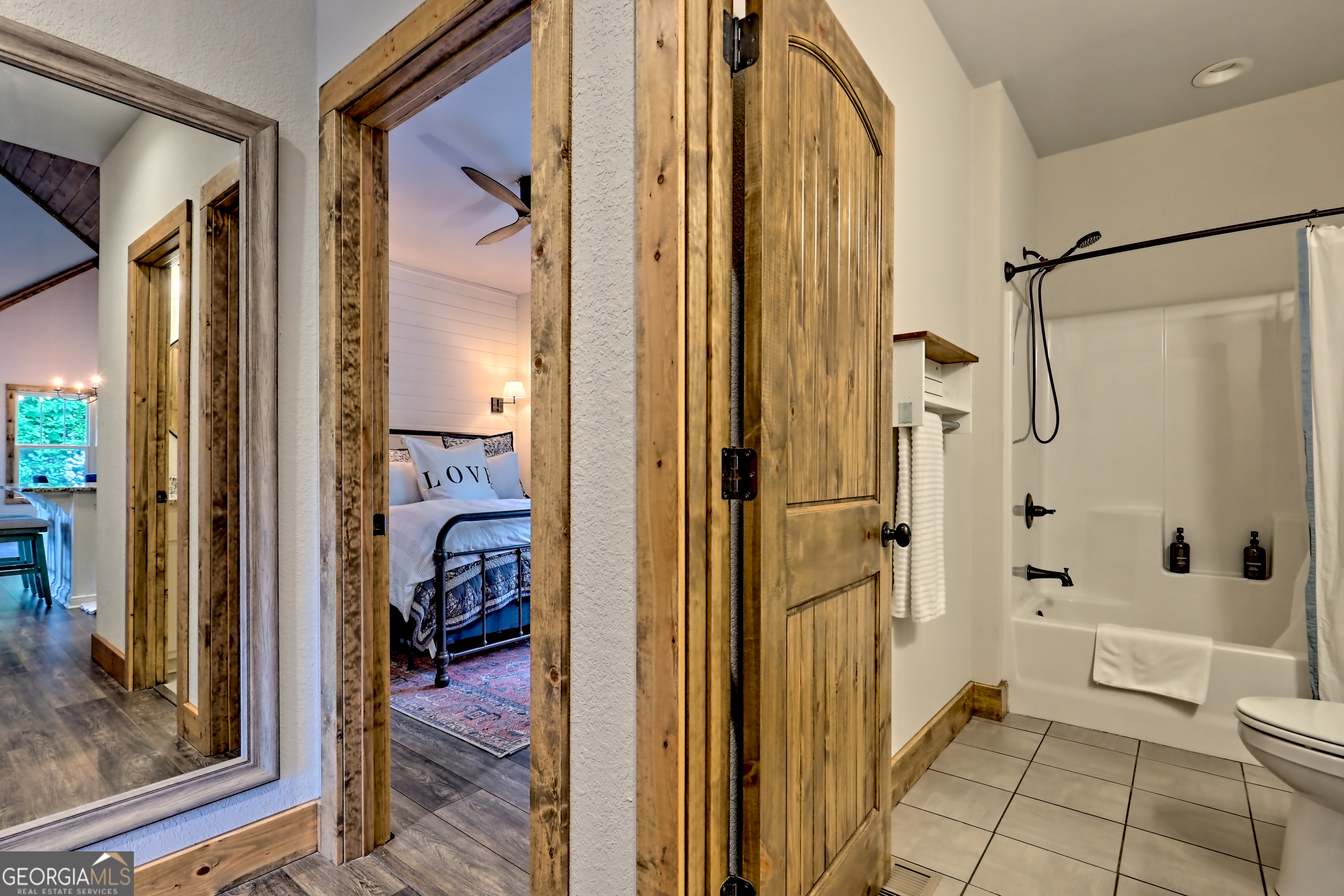 4979 Highway 197 Clarkesville, GA 30523 - Photo 20 of 62 a view of a bathroom with tub and door