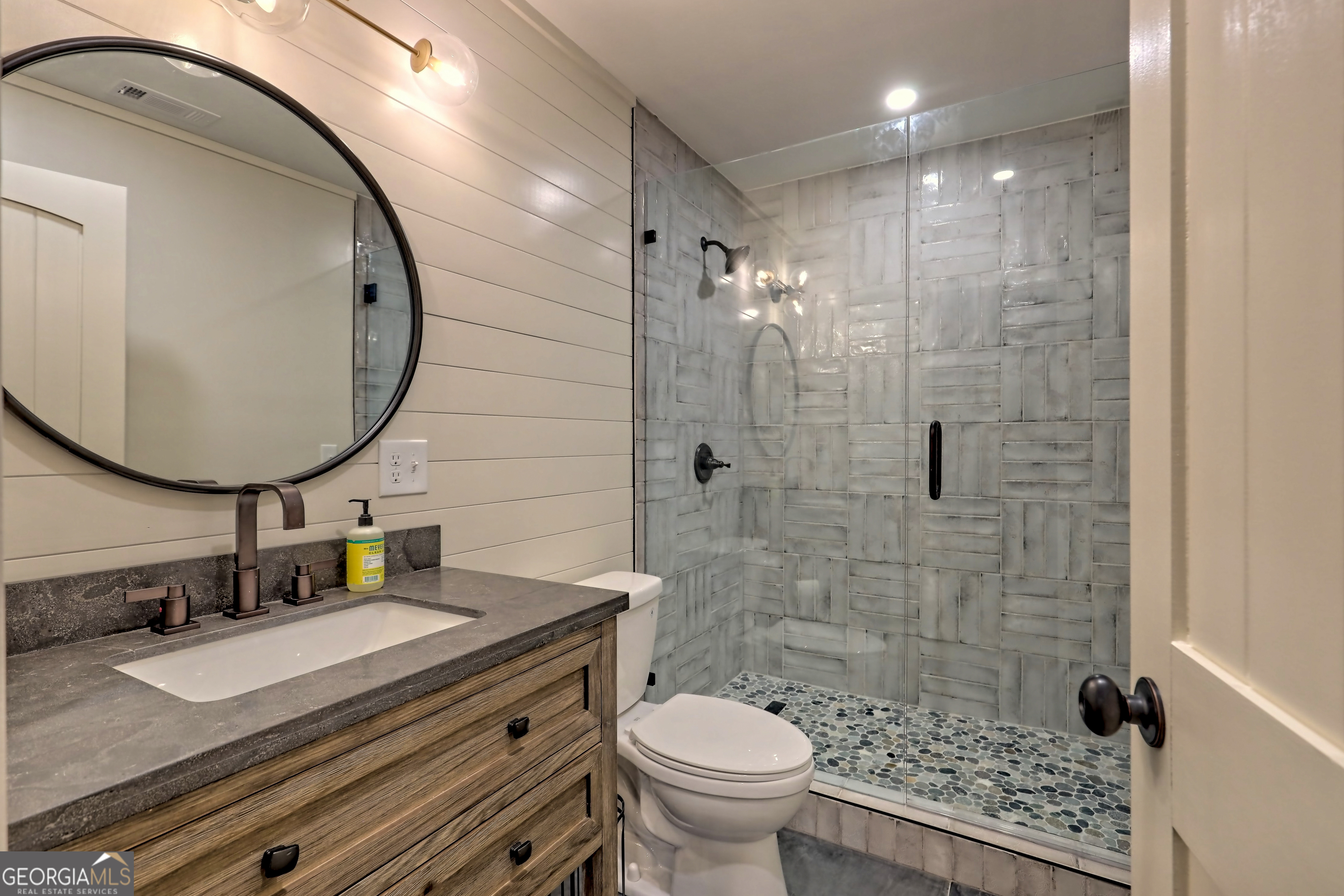 4979 Highway 197 Clarkesville, GA 30523 - Photo 38 of 62 a bathroom with a sink a toilet and a mirror