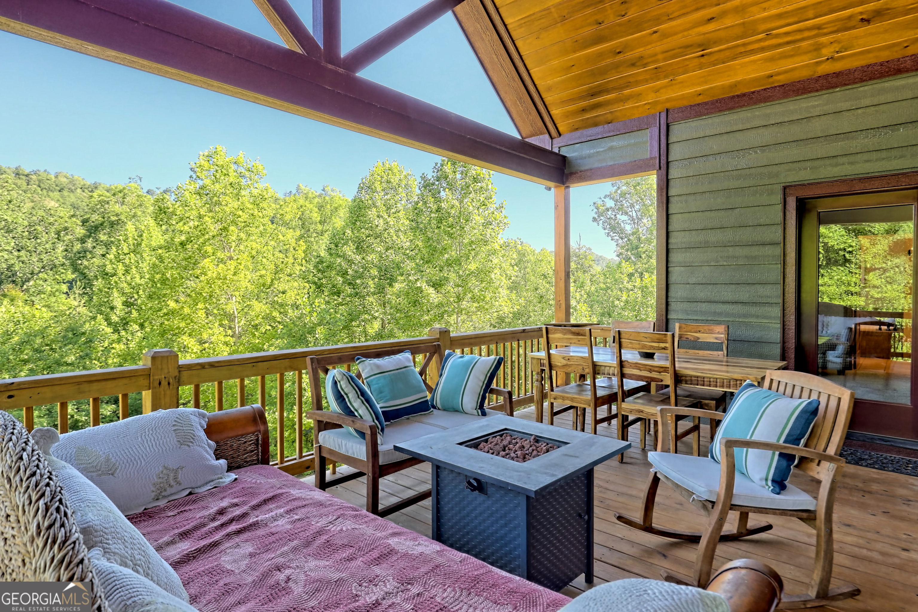 4979 Highway 197 Clarkesville, GA 30523 - Photo 9 of 62 a roof deck with table and chairs and wooden floor