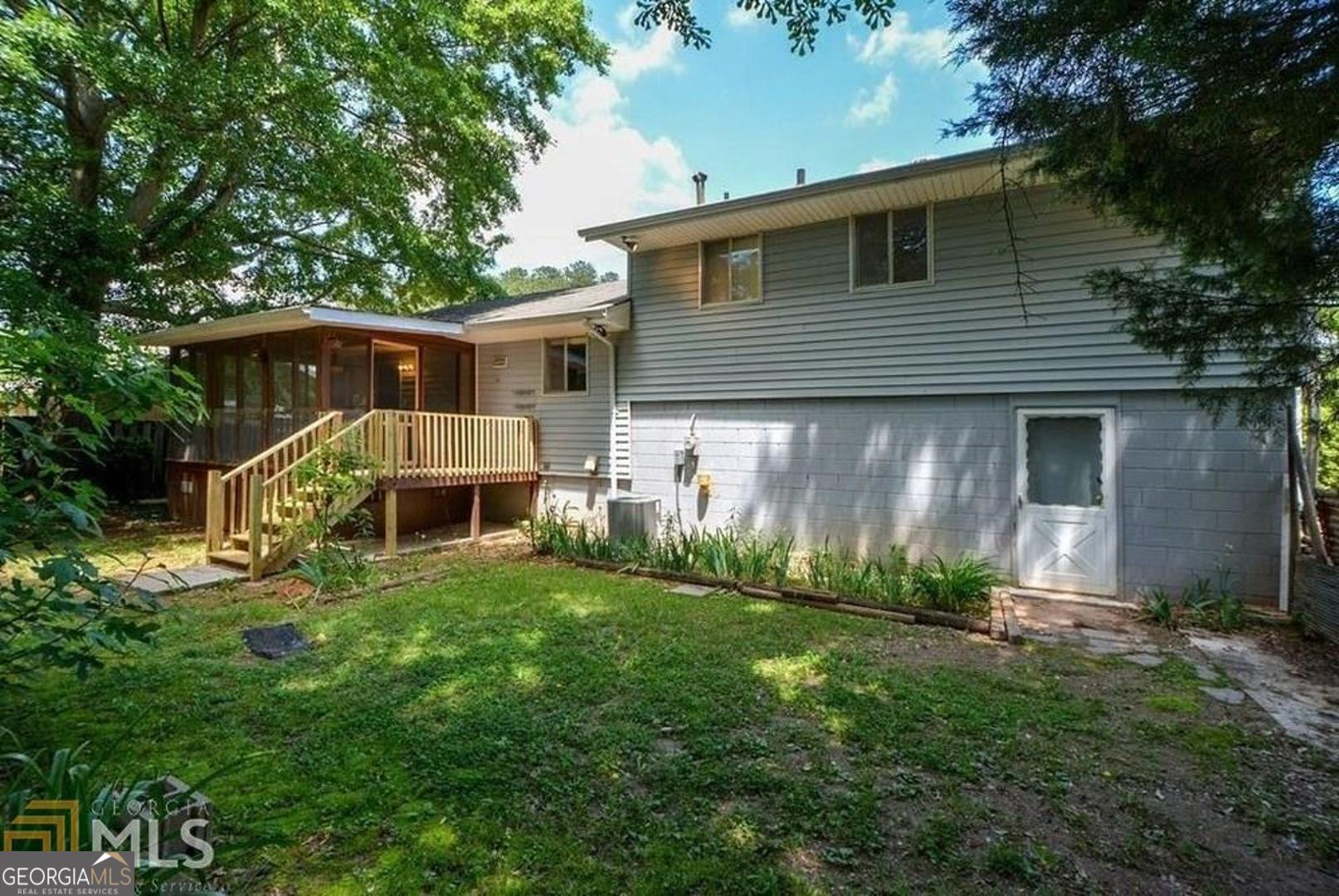 110 Flint River Road Jonesboro, GA 30238 - Photo 6 of 18 a front view of a house with a yard and porch