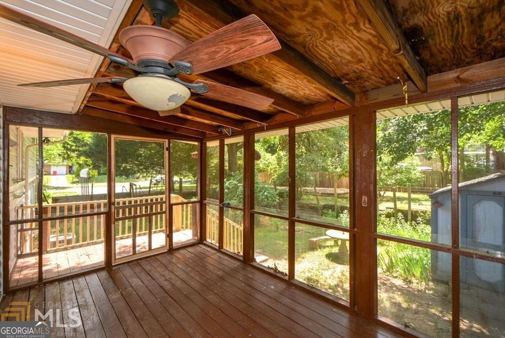 110 Flint River Road Jonesboro, GA 30238 - Photo 7 of 18 a view of room with wooden floor and iron stairs