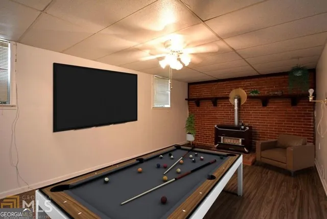 a room with furniture and flat screen tv