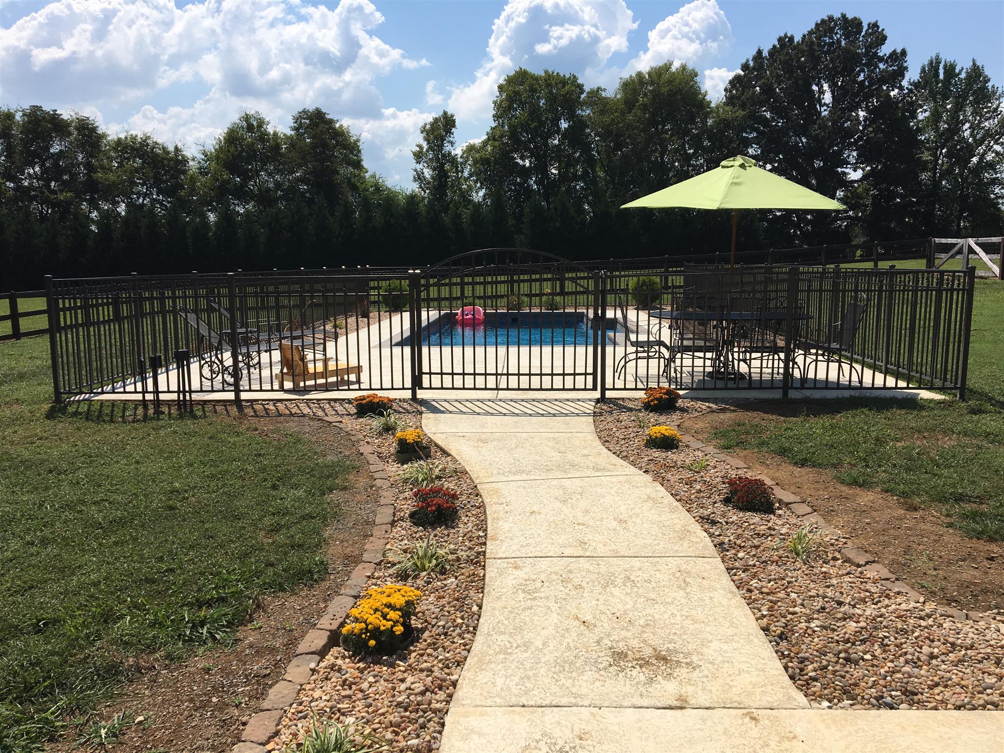 968 Academy Road Lebanon, TN 37087 - Photo 22 of 30 a view of a pathway with a wrought fence