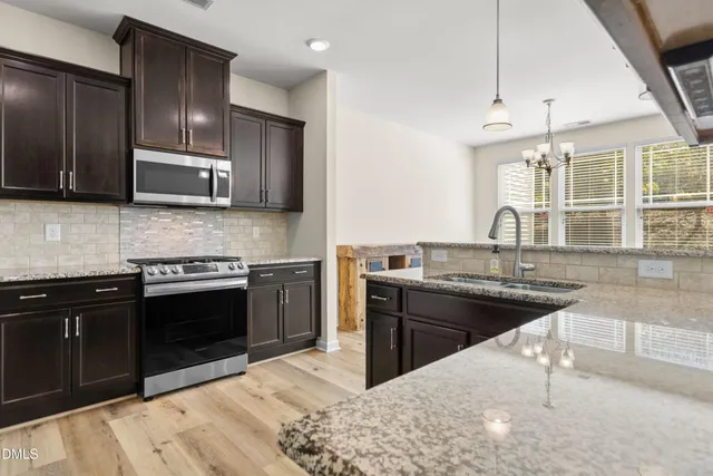 a view of a livingroom with furniture and a window