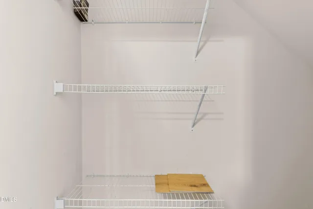 a kitchen with a sink and a wooden floor