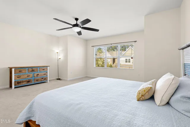 a bedroom with a bed and a table