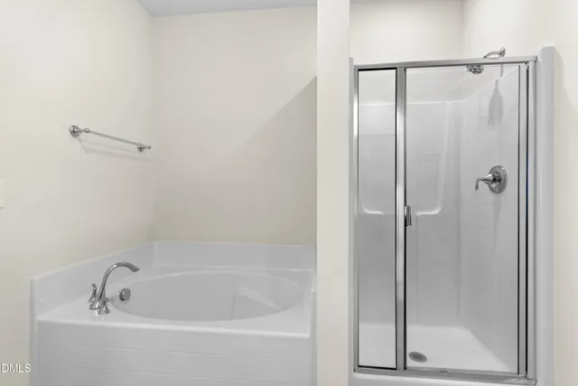 a bedroom with a bed and cabinets