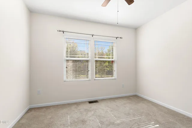a white bath tub with a shower