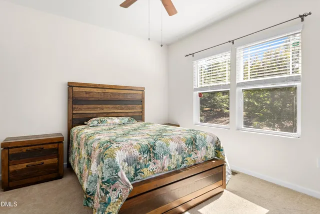 a bathroom with double sink and two mirror
