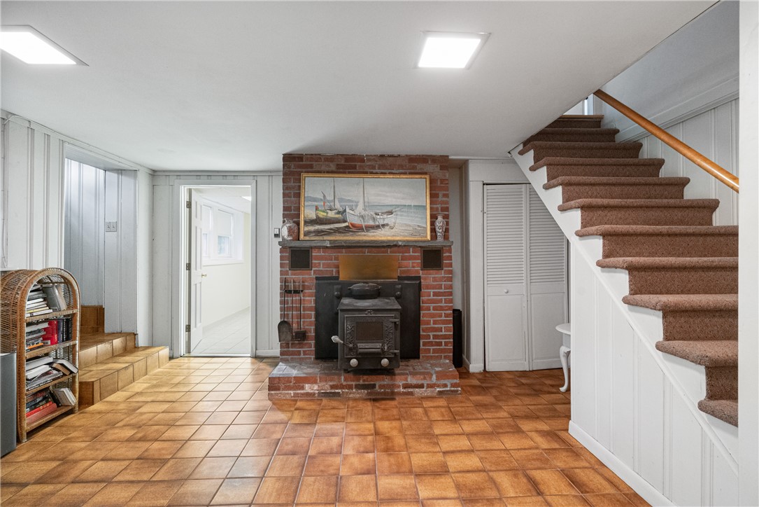 300 Kingstown Road Narragansett, RI 02882 - Photo 19 of 29 Lower level living room with a fireplace!!