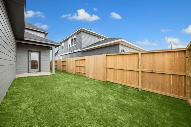 a backyard of a house with lots of green space