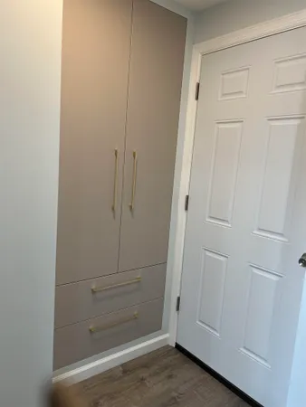 a kitchen with stainless steel appliances a refrigerator sink and wooden floor
