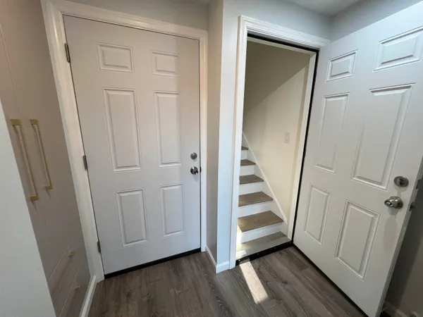 a view of a storage and utility room with washer and dryer