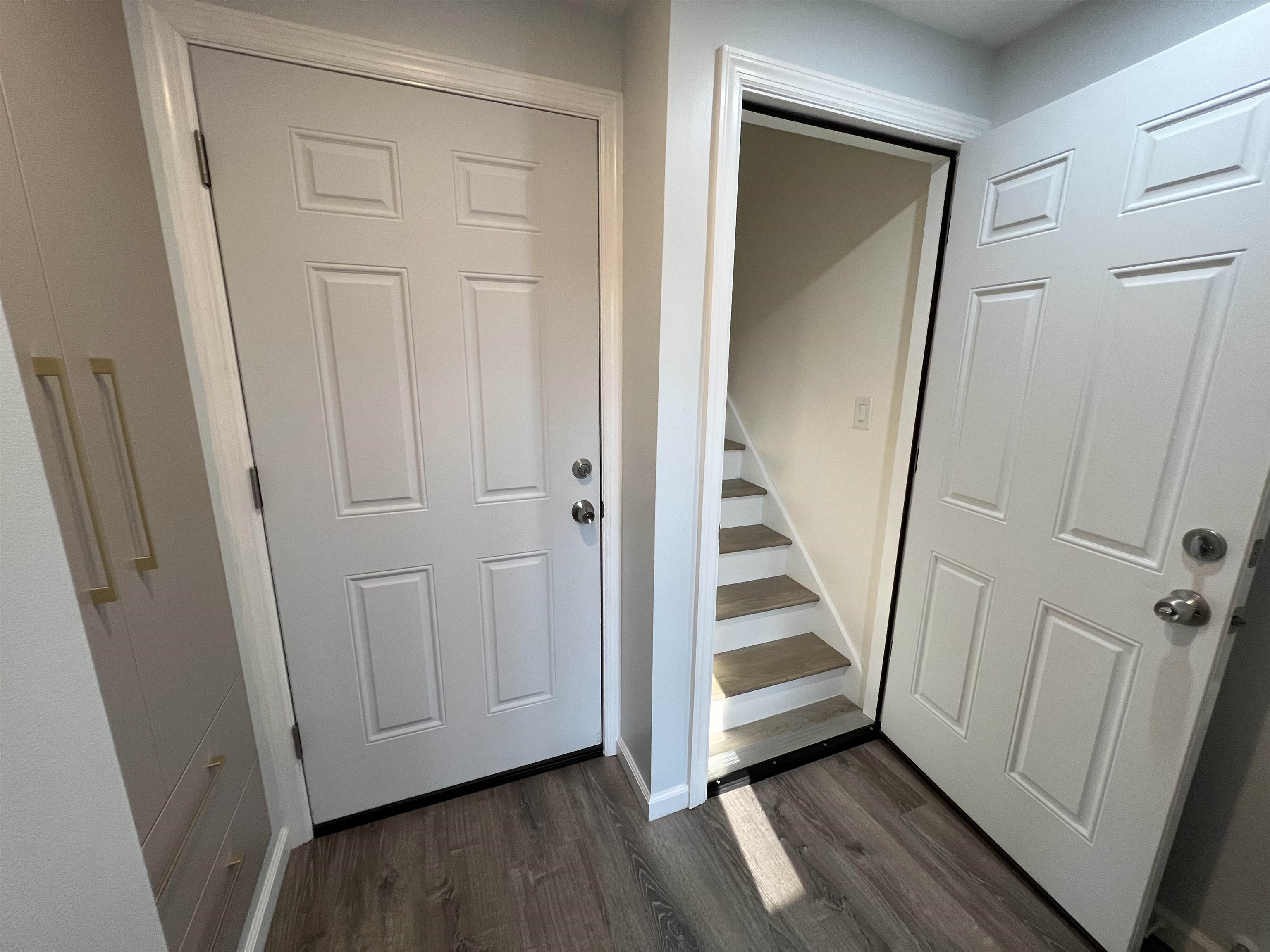 35 MacArthur Avenue, Unit 2 Hasbrouck Heights, NJ 07604 - Photo 5 of 14 a view of a hallway with wooden floor and staircase
