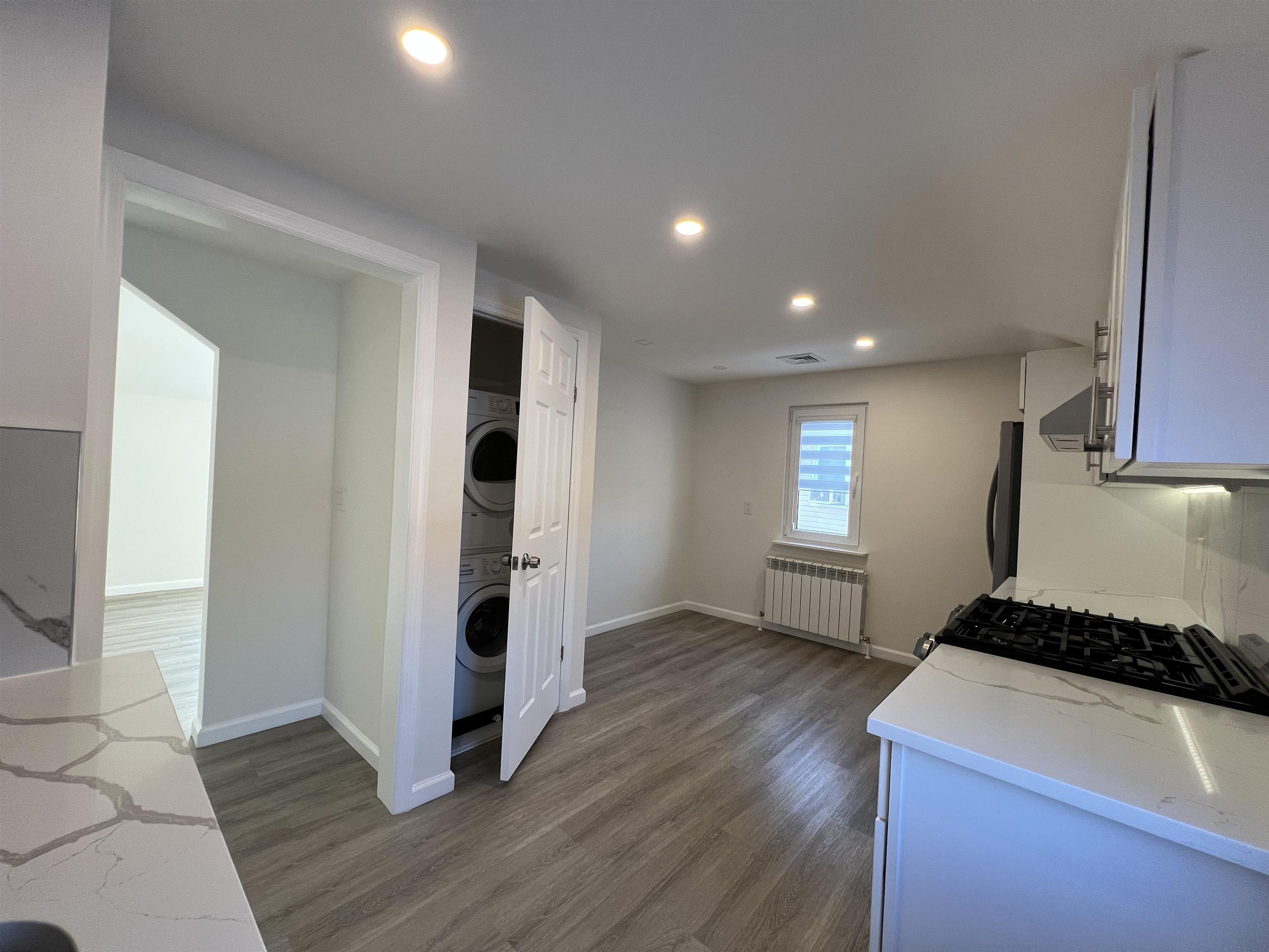 35 MacArthur Avenue, Unit 2 Hasbrouck Heights, NJ 07604 - Photo 7 of 14 a view of hallway with wooden floor