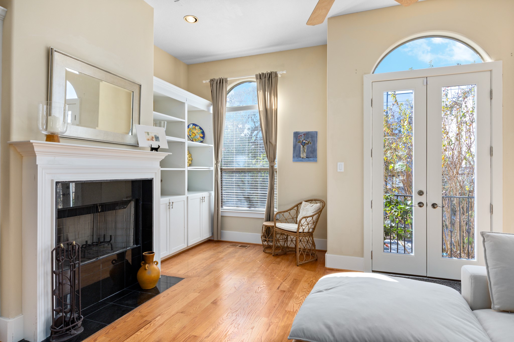 2611 Commonwealth Street Houston, TX 77006 - Photo 13 of 31 Large windows and French doors flood the room with natural light and open to a private balcony, creating a seamless indoor-outdoor flow.