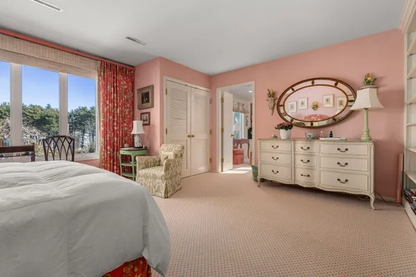 a bed room with a bed and a table