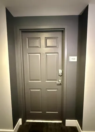 a view of entryway with wooden floor