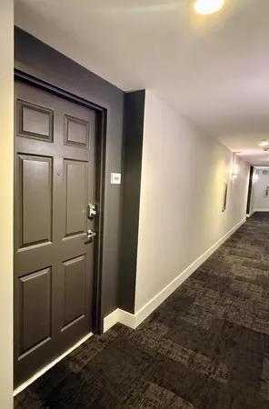 a kitchen with stainless steel appliances granite countertop a refrigerator a stove and a sink with granite countertops