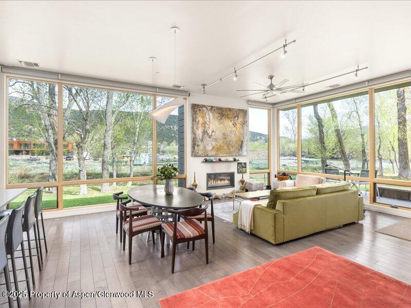 a living room with furniture and a large window