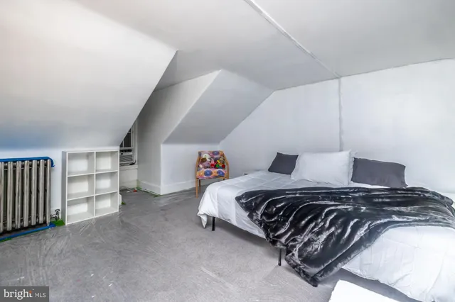 a bedroom with a bed and closet