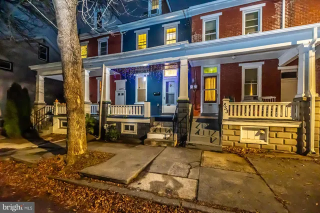a view of a building with car parked