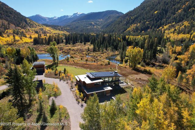 a view of a swimming pool with a yard
