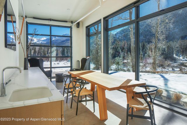 a dining room with furniture and window