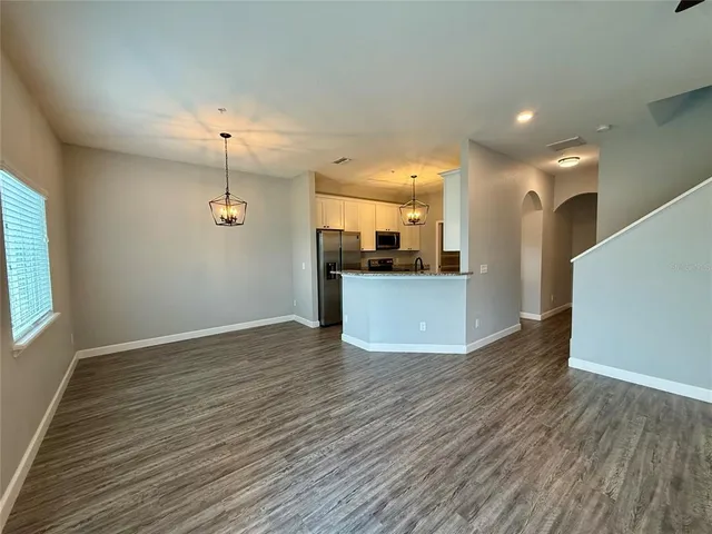 a view of a kitchen with a sink and a microwave