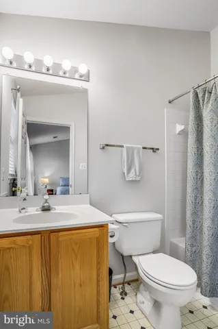 a view of an empty room and wooden floor