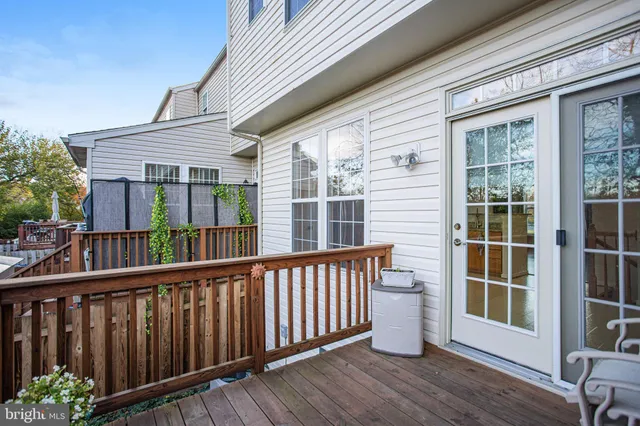 a front view of a house with cars parked