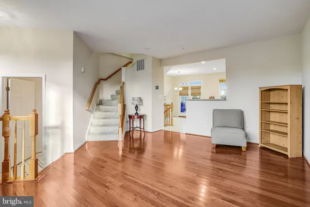a view of a livingroom with furniture and a ceiling fan