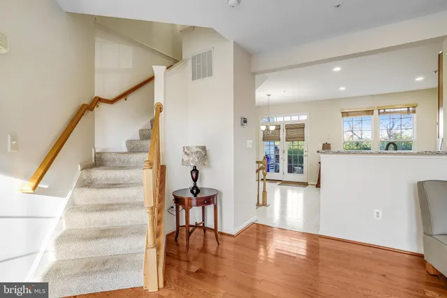 a view of a workspace with wooden floor and bedroom view