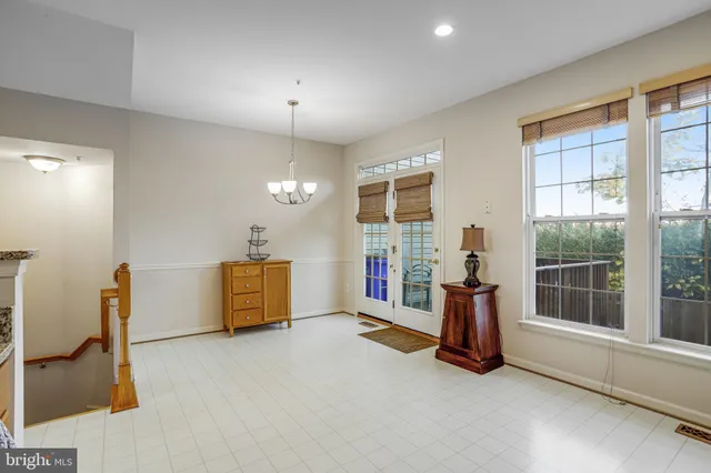 a bedroom with a bed and a lamp