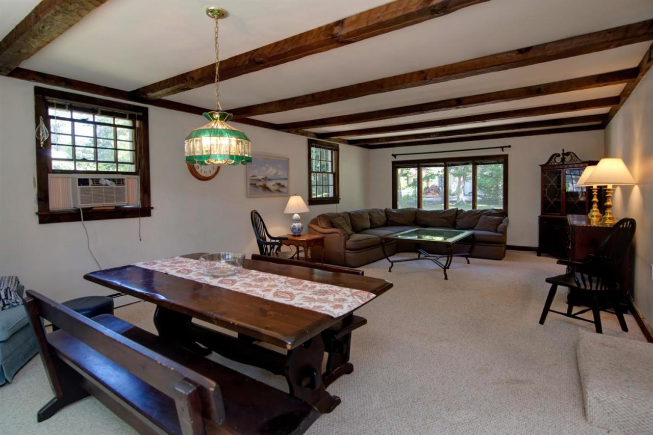 67 Lumbert Mill Road Centerville, MA 02632 - Photo 8 of 18 a living room with furniture and a large window