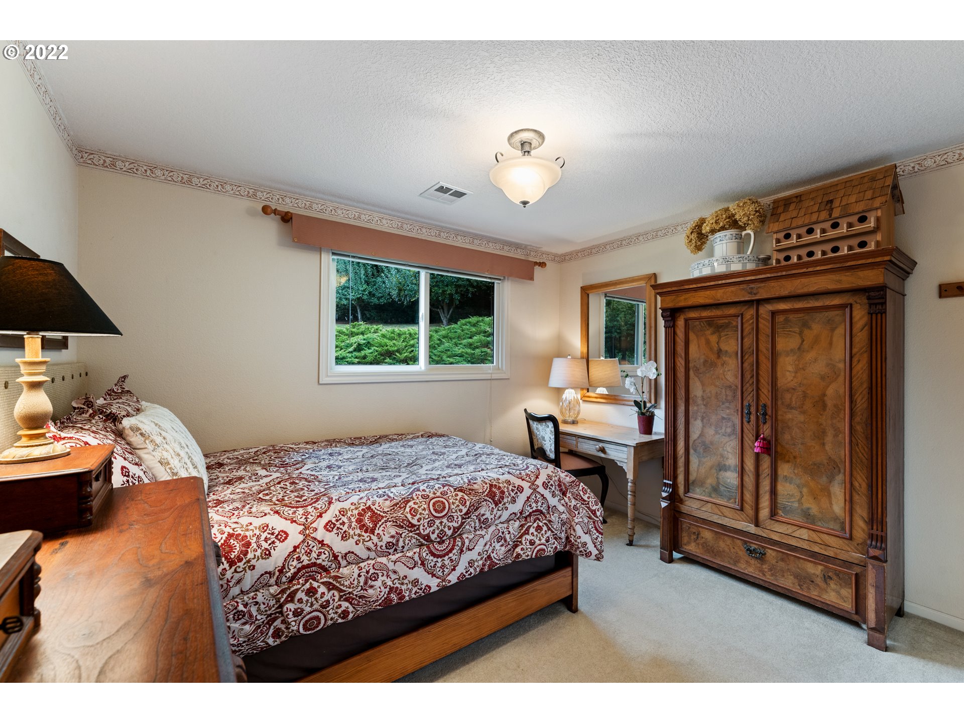 22913 Northeast 16th Street Camas, WA 98607 - Photo 12 of 32 a bedroom with a bed and a table in it