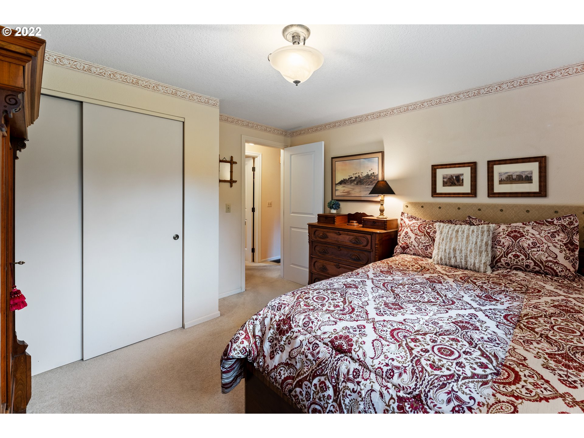 22913 Northeast 16th Street Camas, WA 98607 - Photo 13 of 32 a bedroom with a bed and a walk in closet