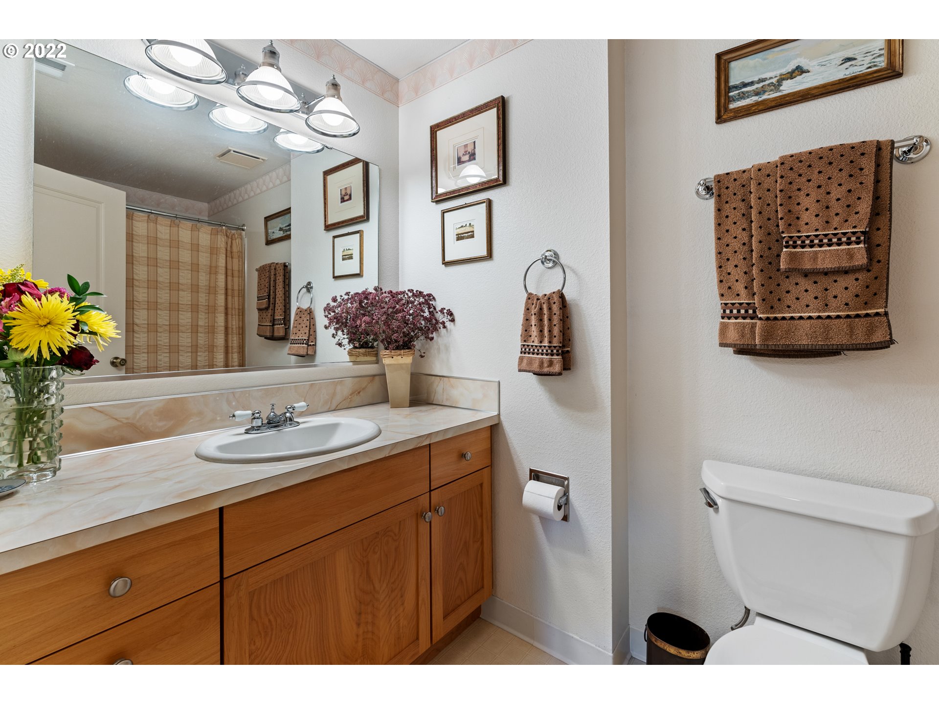 22913 Northeast 16th Street Camas, WA 98607 - Photo 14 of 32 a bathroom with a sink a toilet and mirror